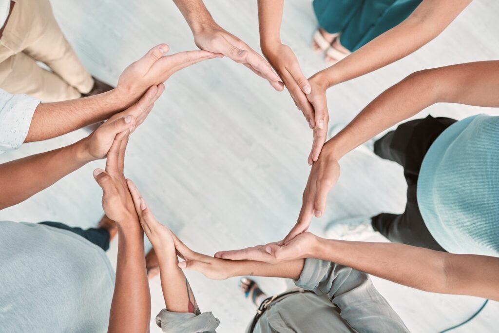 Team building, support and business people with hands in a circle for partnership, collaboration an